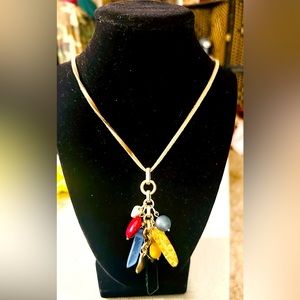 New-Chicos long stone pendant necklace with suede chain featuring gold tones.